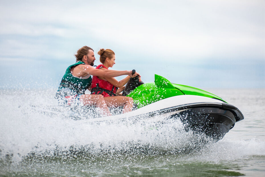 Couple riding a jet ski