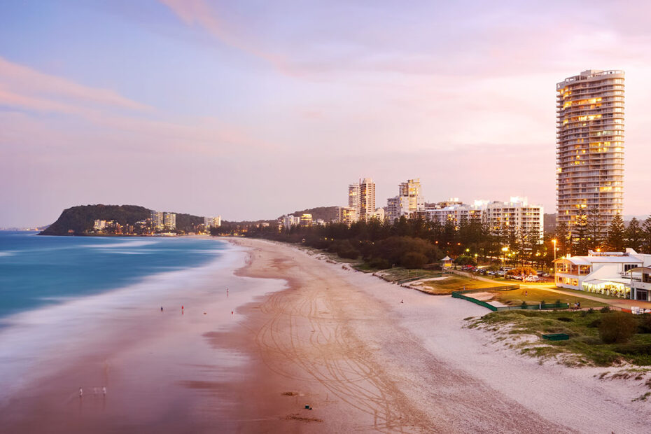 Sunset view along Burleigh Heads beach to the headland
